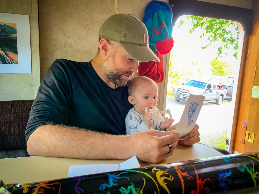 Glen and his child inside their RV.